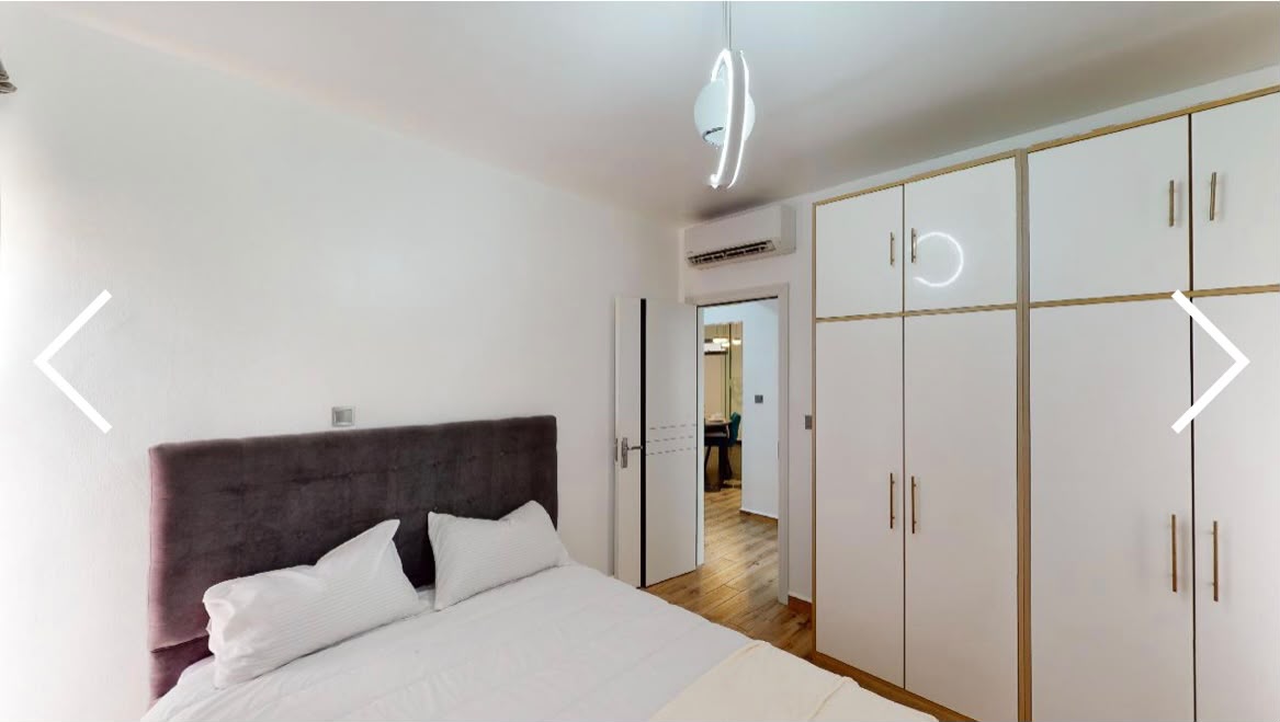 Rendering of a guest bedroom with fitted wardrobes